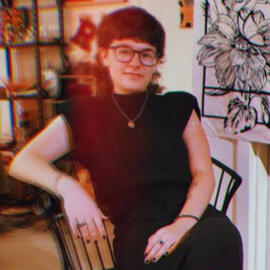 Silvan sitting in a chair